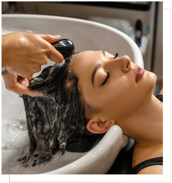 Client enjoying rejuvenating hair spa therapy at the best unisex salon in Gurgaon