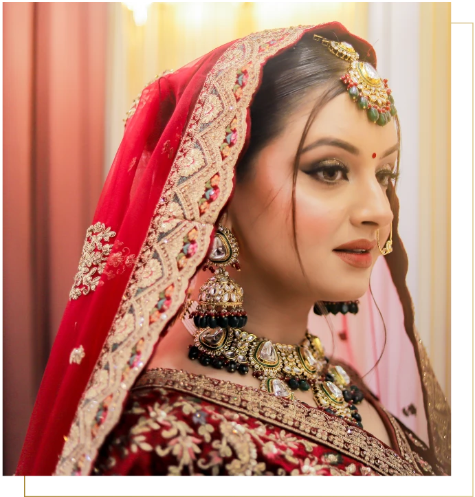 Indian-women-in-a-red-bridal-attire-and-Indian-bridal-makeup-look-done-by-Diya-Sharma-the-top-Indian-bridal-make-up-artist-in-Gurgaon.webp